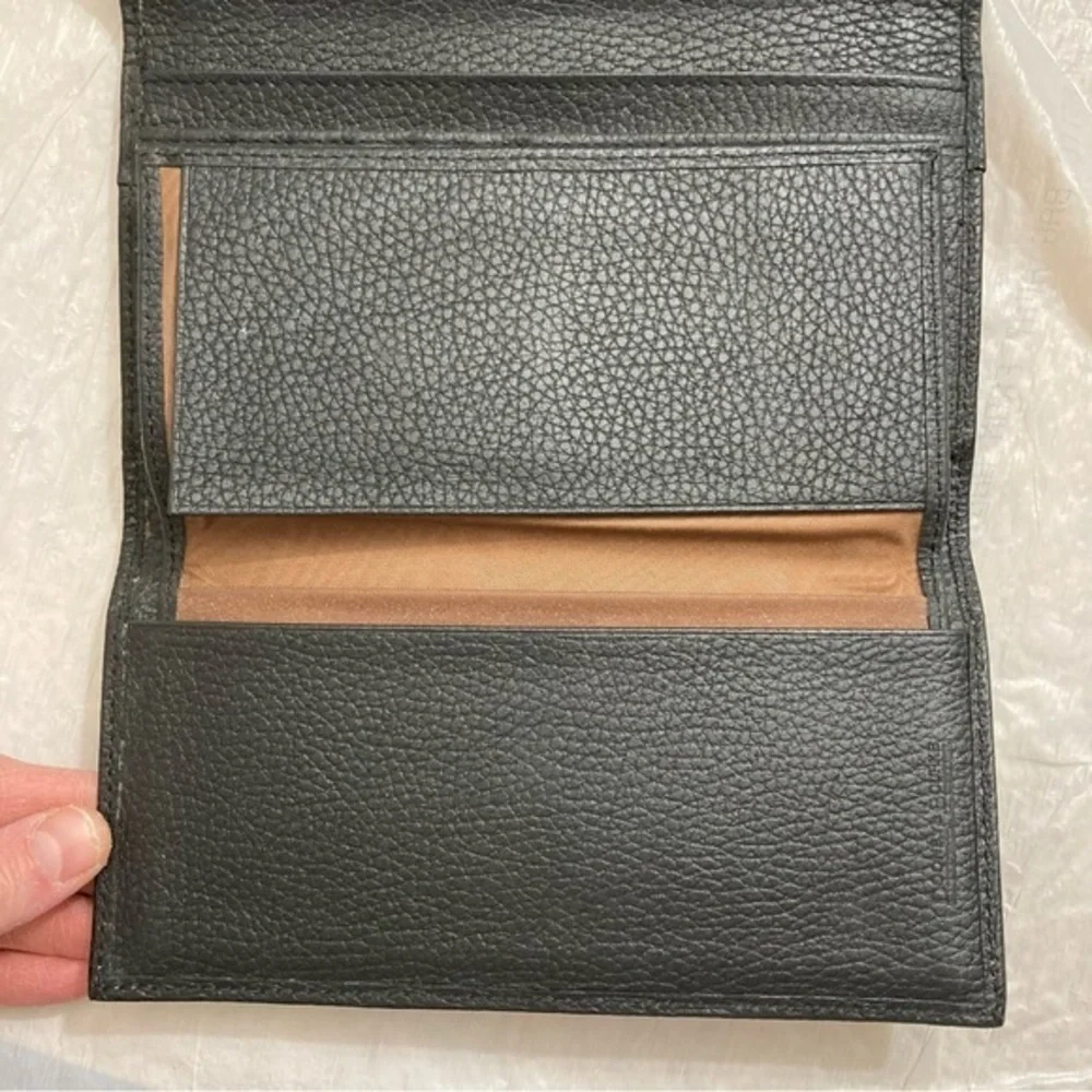 Dooney and Bourke rare perforated black pebbled leather 2 piece wallet set